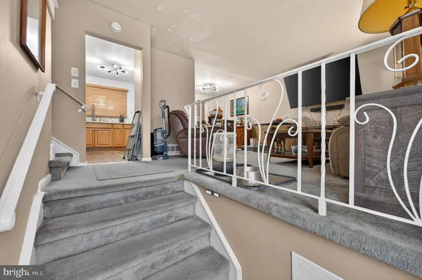 a view of a hallway with stairs