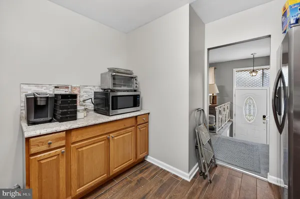 a kitchen with stainless steel appliances a stove microwave and refrigerator