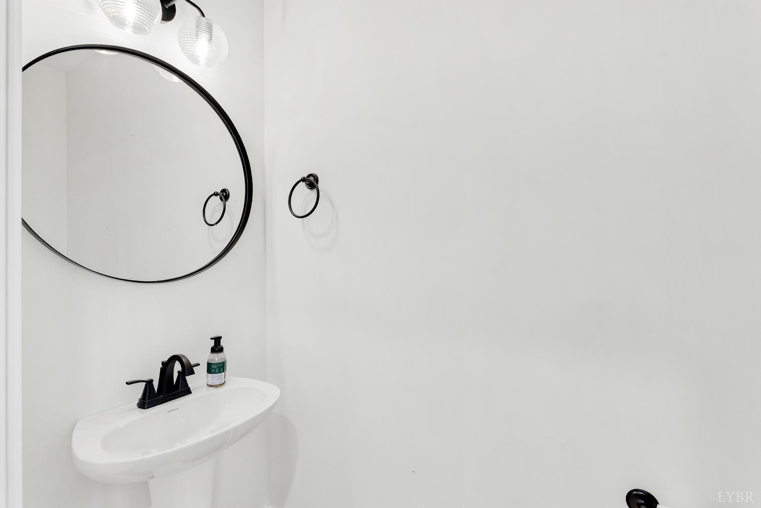 556 Leesville Road, Unit 406 Lynchburg, VA 24502 - Photo 5 of 39 a bathroom with a sink and mirror