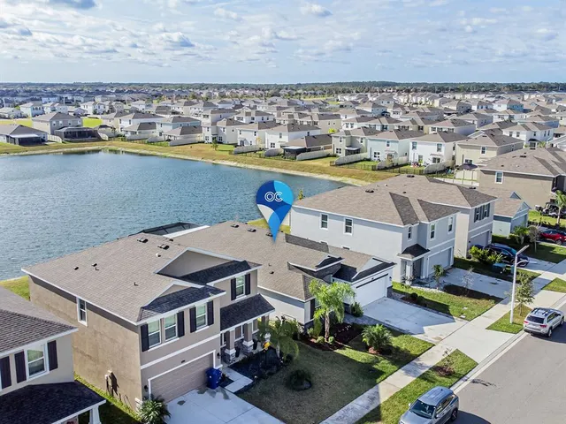 a view of a house with porch and garden