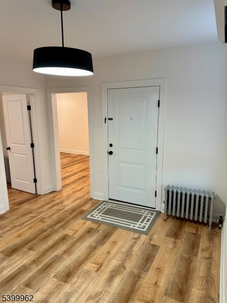 128 King Street, Unit 2 Nutley, NJ 07110 - Photo 2 of 8 a view of a livingroom with wooden floor