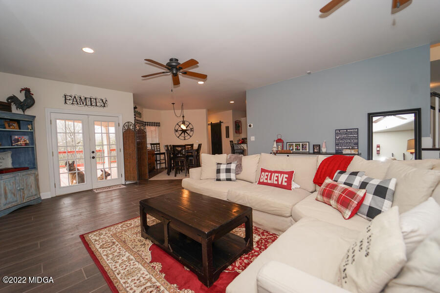 5281 Purple Road Byron, GA 31008 - Photo 16 of 42 a living room with furniture and wooden floor