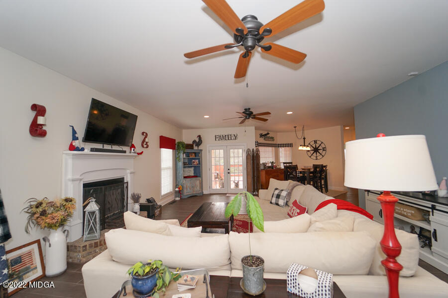 5281 Purple Road Byron, GA 31008 - Photo 17 of 42 a living room with furniture and a fireplace