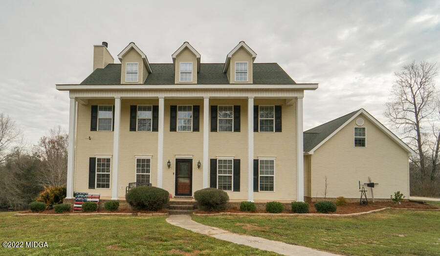 5281 Purple Road Byron, GA 31008 - Photo 2 of 42 a front view of a house with a yard