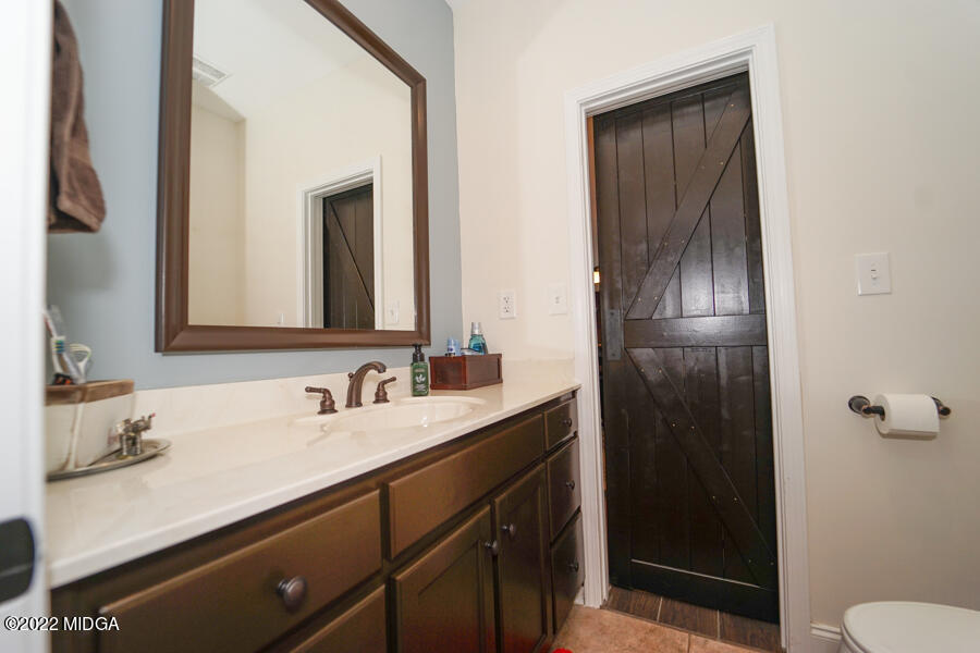 5281 Purple Road Byron, GA 31008 - Photo 24 of 42 a bathroom with a sink and a mirror