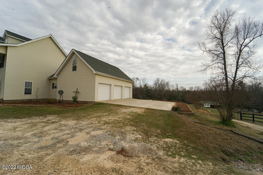 5281 Purple Road Byron, GA 31008 - Photo 4 of 42 a view of a house with backyard and trees