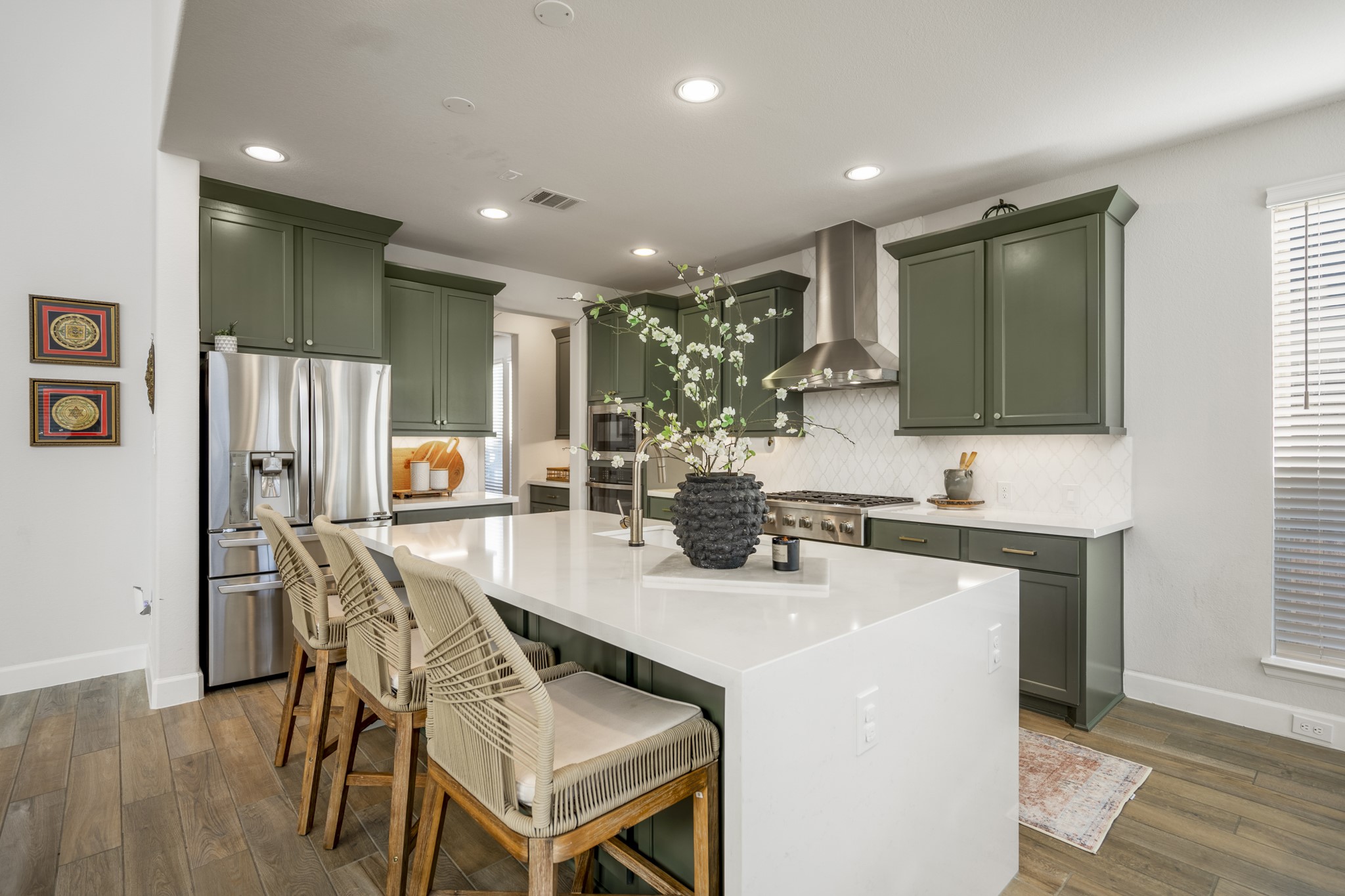 4226 Ana Ridge Lane Fulshear, TX 77441 - Photo 15 of 50 a kitchen with a table chairs refrigerator and microwave