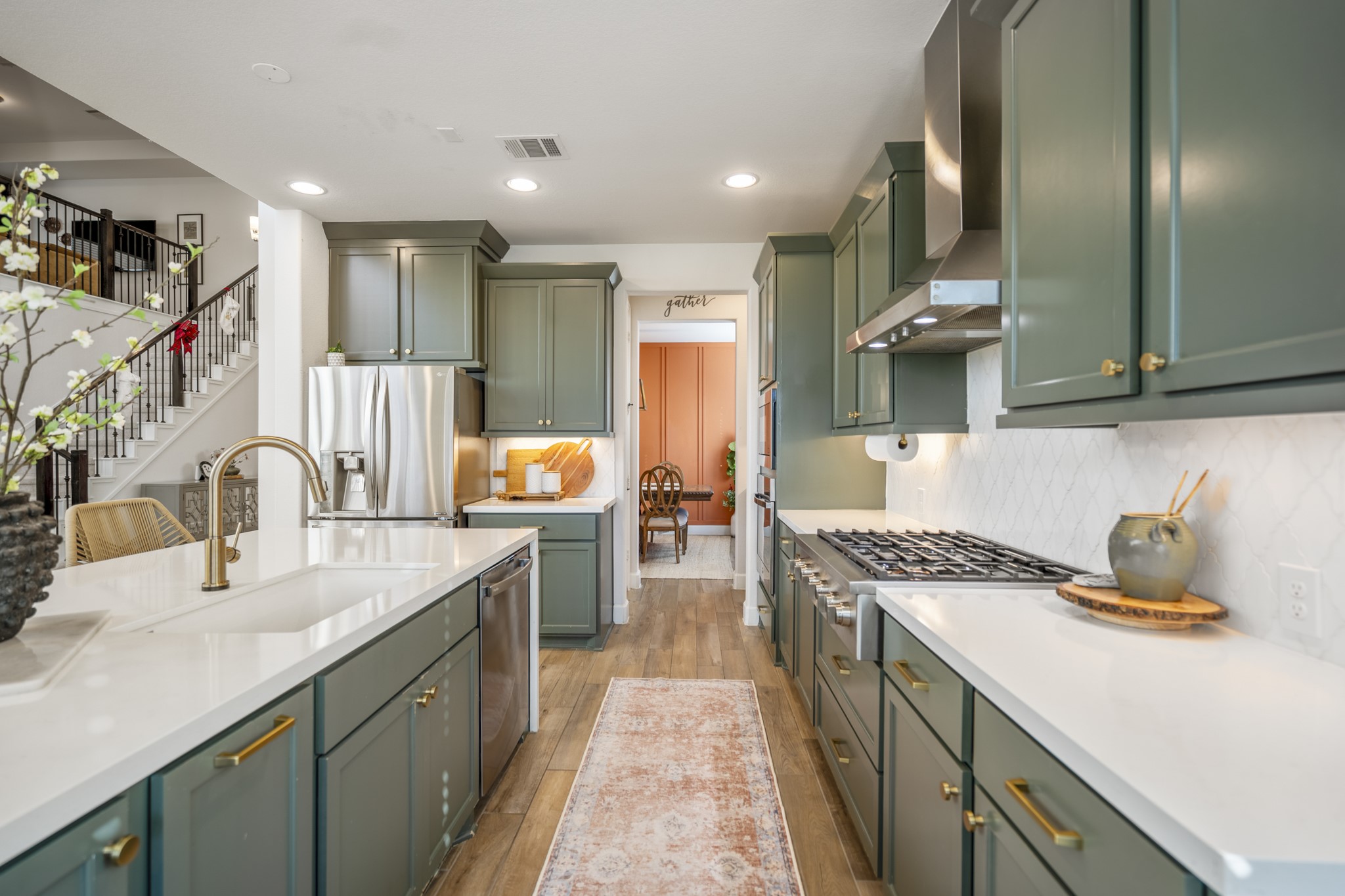 4226 Ana Ridge Lane Fulshear, TX 77441 - Photo 19 of 50 a kitchen with a sink stove and cabinets