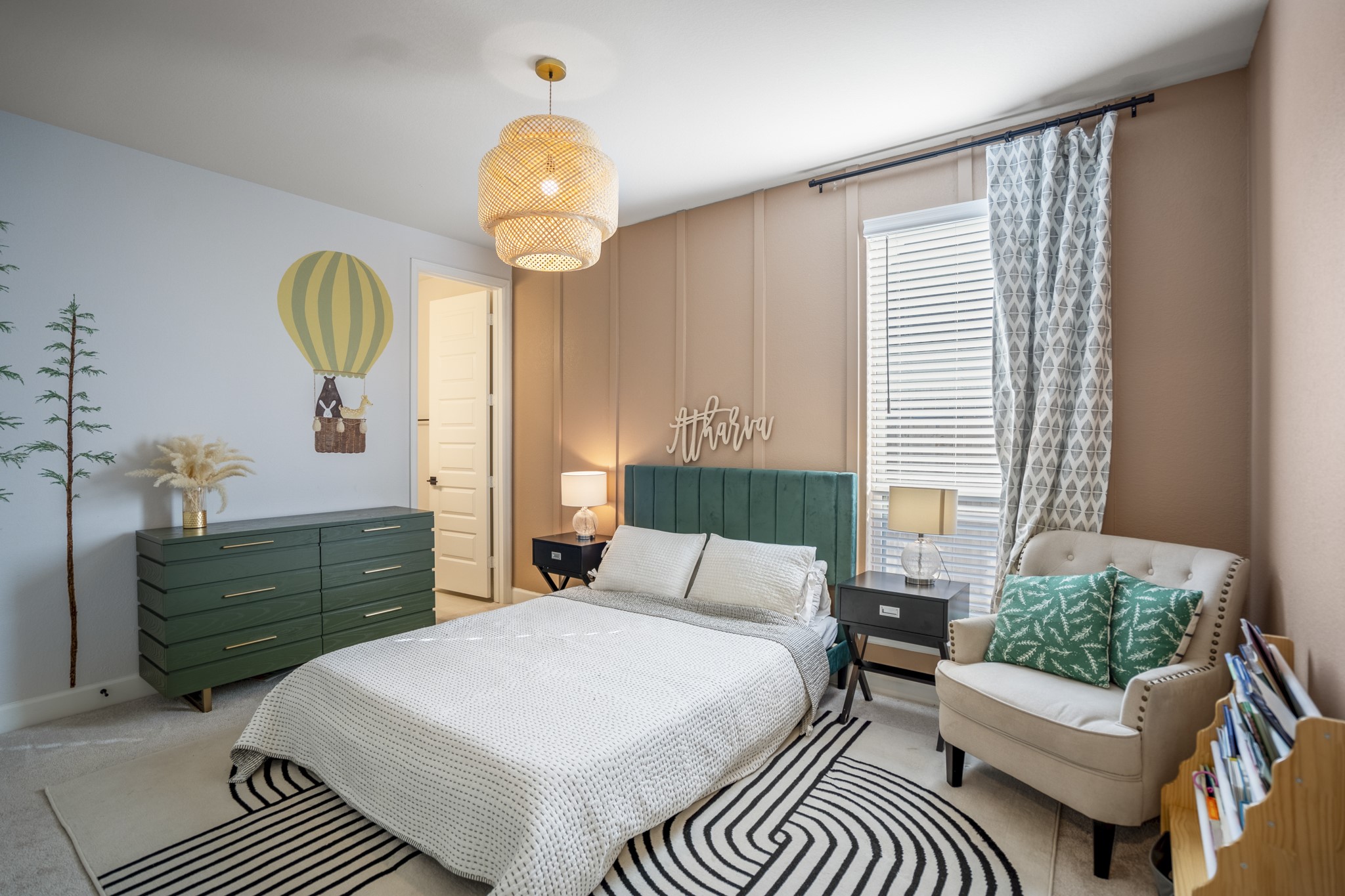 4226 Ana Ridge Lane Fulshear, TX 77441 - Photo 34 of 50 a bedroom with a bed and a chandelier