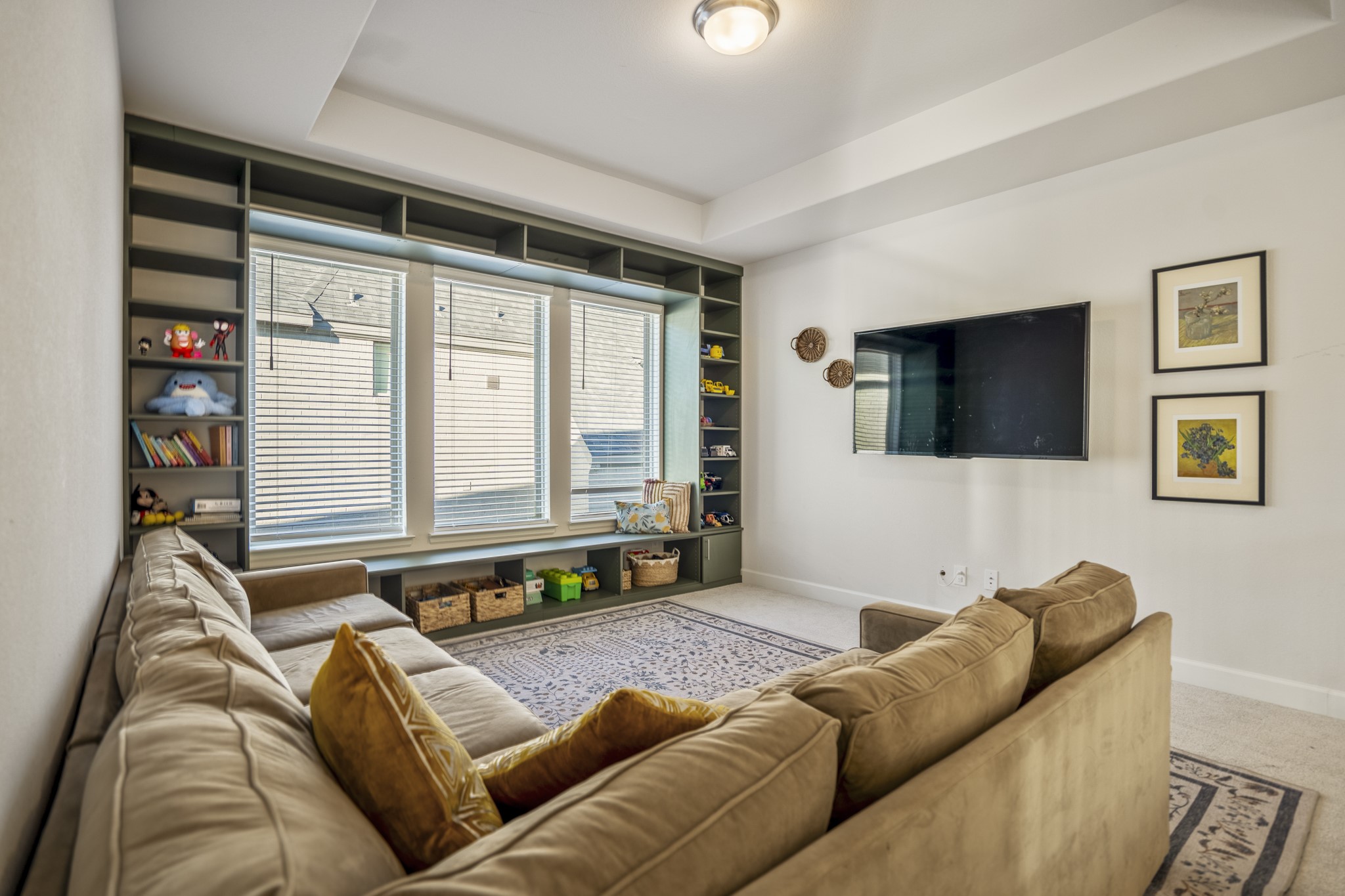 4226 Ana Ridge Lane Fulshear, TX 77441 - Photo 37 of 50 a living room with furniture and a flat screen tv