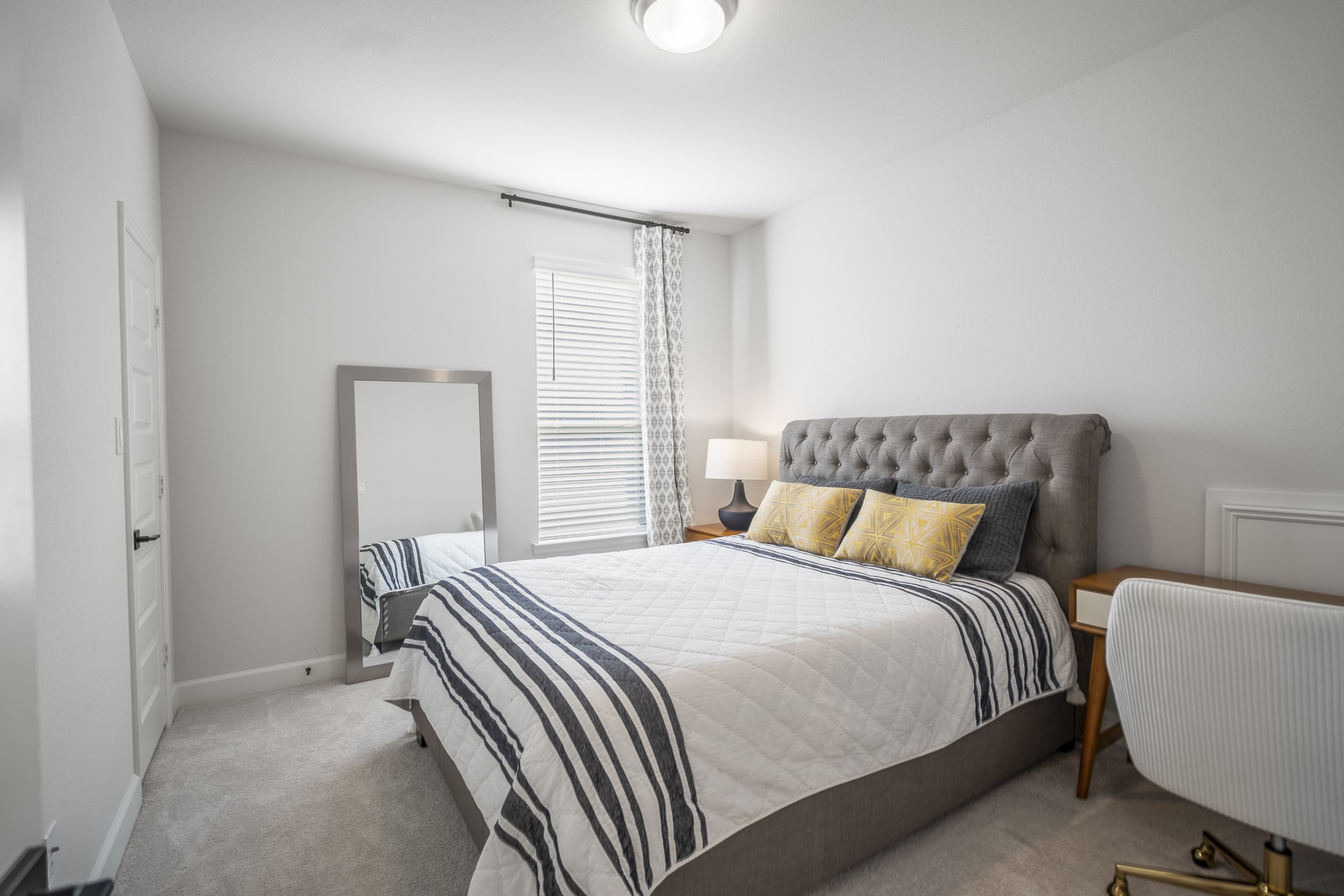 4226 Ana Ridge Lane Fulshear, TX 77441 - Photo 42 of 50 a bedroom with a bed and a lamp