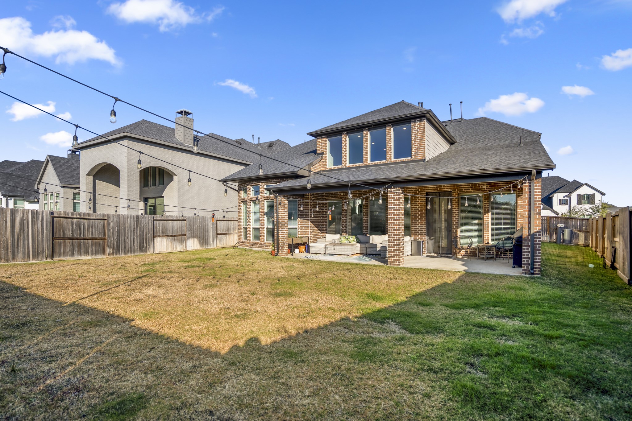 4226 Ana Ridge Lane Fulshear, TX 77441 - Photo 48 of 50 a view of a house with sitting area and garden