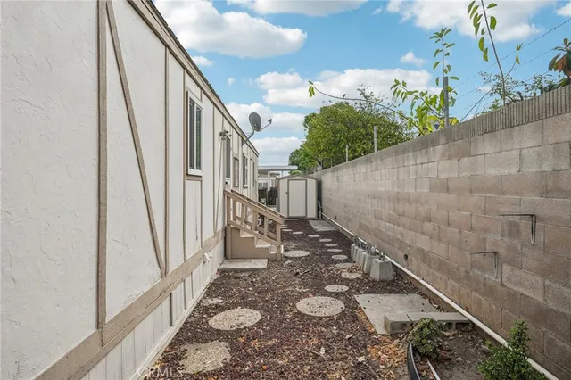 a view of swimming pool with outdoor seating and plants