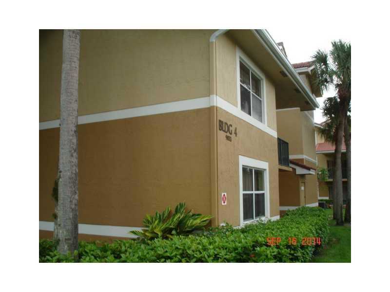 9033 Wiles Road, Unit 1084 Coral Springs, FL 33067 - Photo 1 of 12 a view of backyard with plants