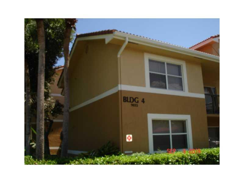 9033 Wiles Road, Unit 1084 Coral Springs, FL 33067 - Photo 11 of 12 a side view of a house