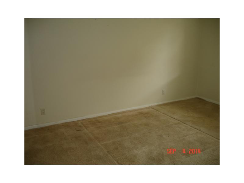 9033 Wiles Road, Unit 1084 Coral Springs, FL 33067 - Photo 12 of 12 a open area with wooden floor