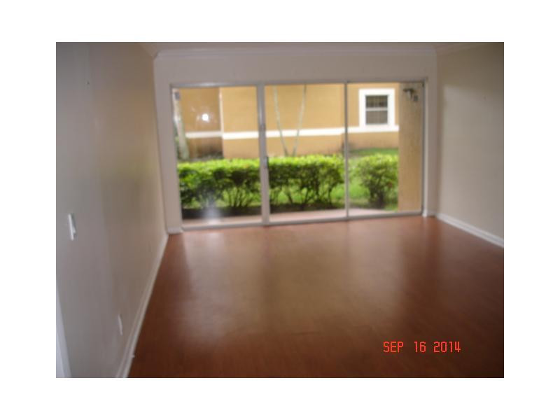 9033 Wiles Road, Unit 1084 Coral Springs, FL 33067 - Photo 2 of 12 a view of a black and white floor