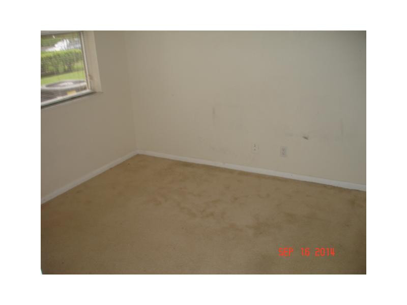 9033 Wiles Road, Unit 1084 Coral Springs, FL 33067 - Photo 5 of 12 a open area with cabinets