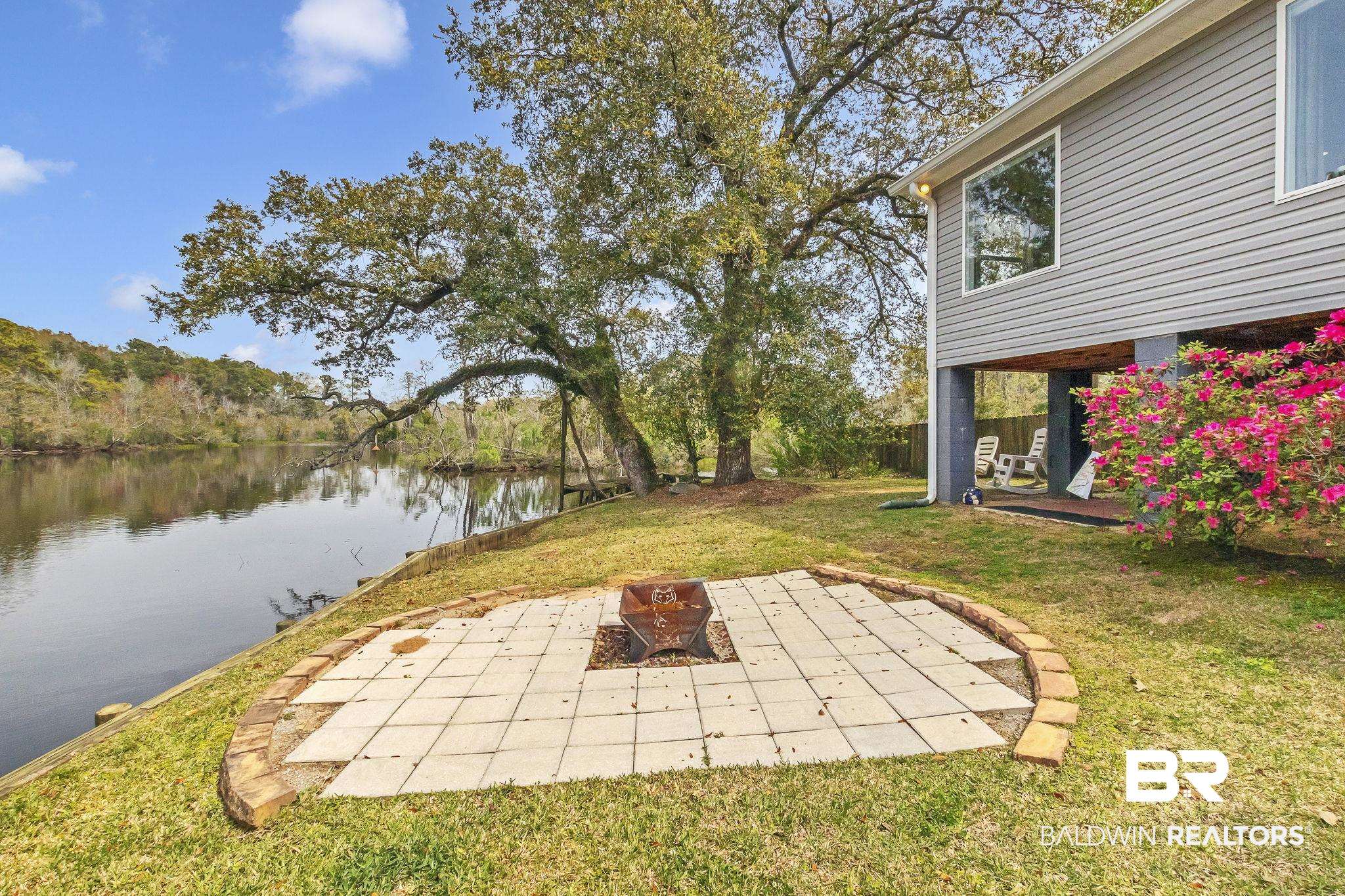 2901 Alston Court Mobile, AL 36605 - Photo 47 of 59 View of yard featuring a patio, a water view, a fire pit, and fence