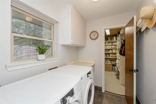 a utility room with a window dryer and washer