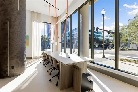 a room with musical instrument table and windows