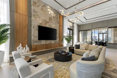 a large room with lots of furniture and a large window