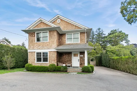 front view of a house next to a yard