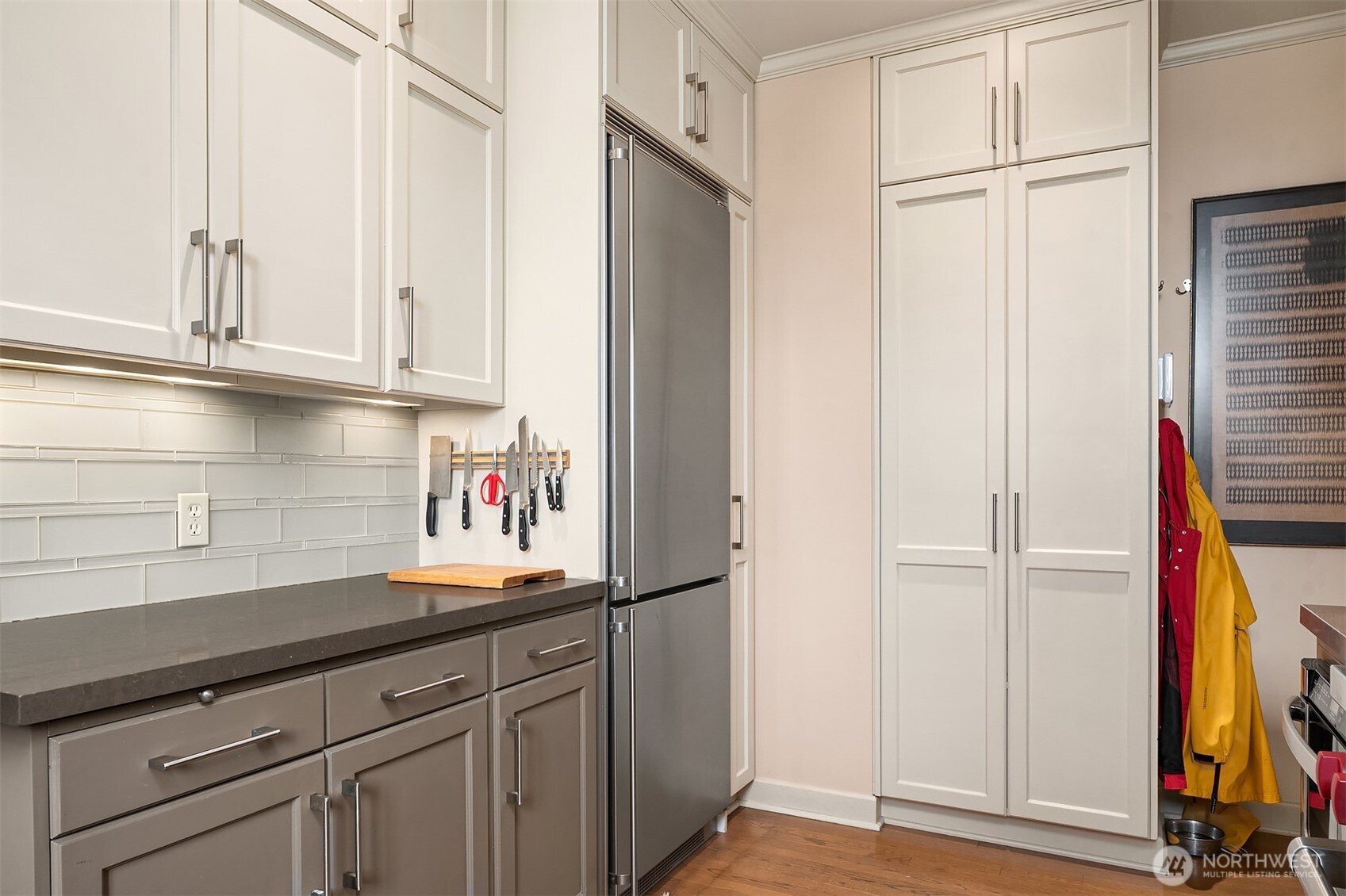 941 11th Avenue East, Unit 3 Seattle, WA 98102 - Photo 15 of 24 a kitchen with stainless steel appliances granite countertop a refrigerator and a sink