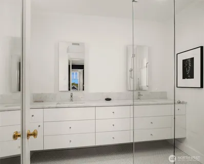a bathroom with a double vanity sink and mirror