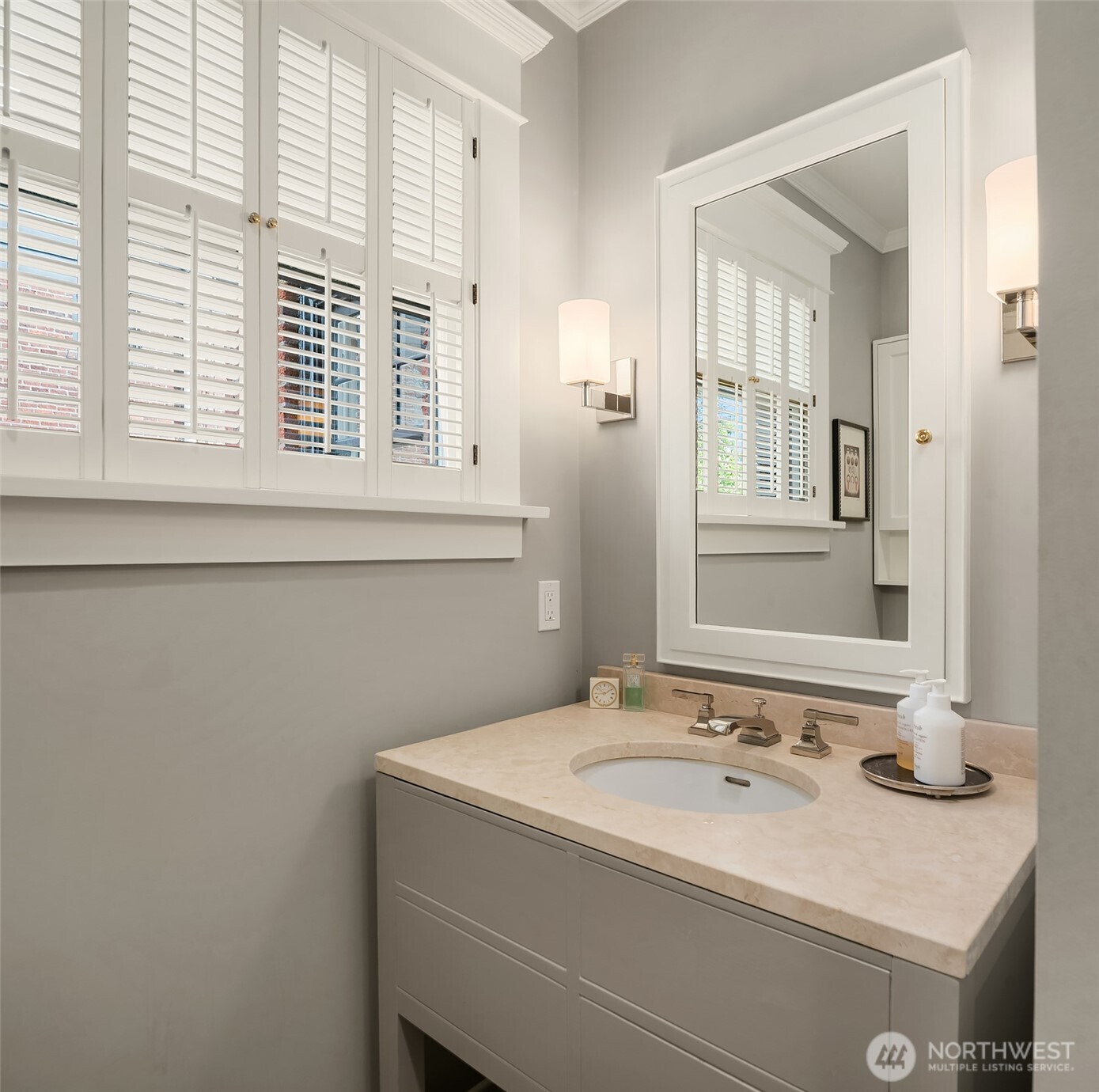941 11th Avenue East, Unit 3 Seattle, WA 98102 - Photo 22 of 24 a bathroom with a sink and a mirror