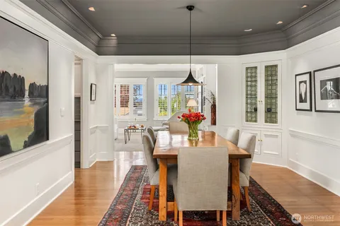 a view of a dining room with furniture window and wooden floor