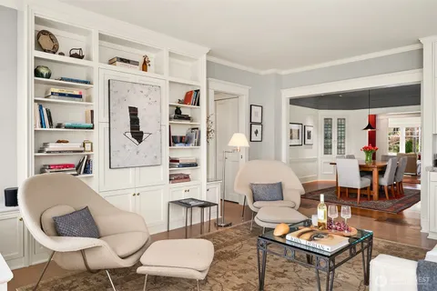 a living room with furniture and a table