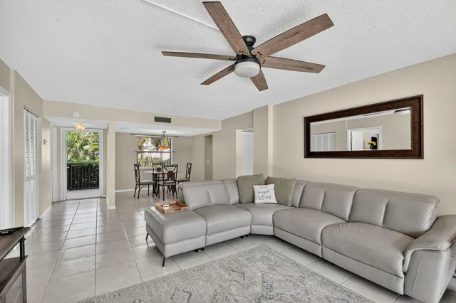 a bathroom with a granite countertop double vanity sink and a mirror