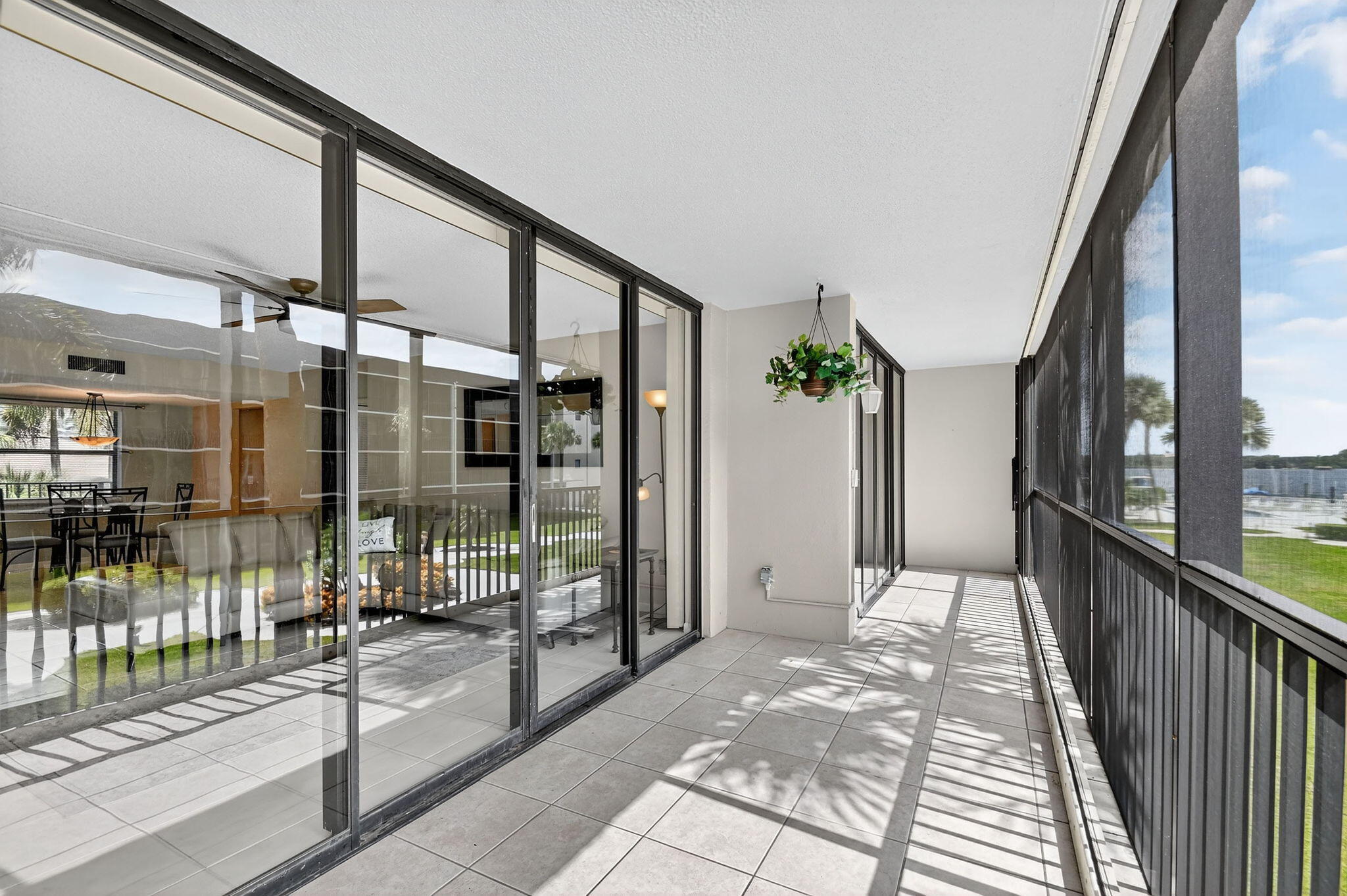 2424 North Federal Highway, Unit 207 Boynton Beach, FL 33435 - Photo 8 of 49 a porch with a glass door