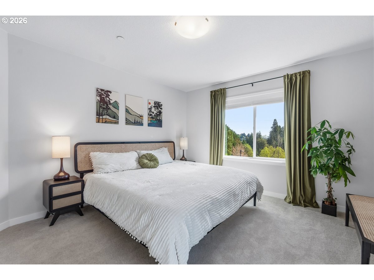 16275 Southwest Jade View Way Beaverton, OR 97007 - Photo 26 of 34 a bedroom with a large bed and a large window