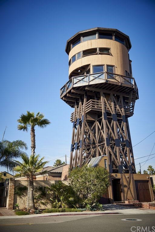 1 Anderson Street Seal Beach, CA 92649 - Photo 2 of 23 a picture of a tree in front of a house