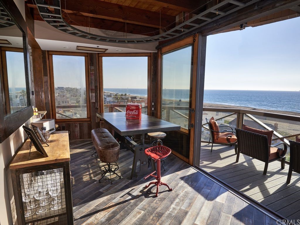 1 Anderson Street Seal Beach, CA 92649 - Photo 11 of 23 a view of a livingroom with furniture and floor to ceiling window