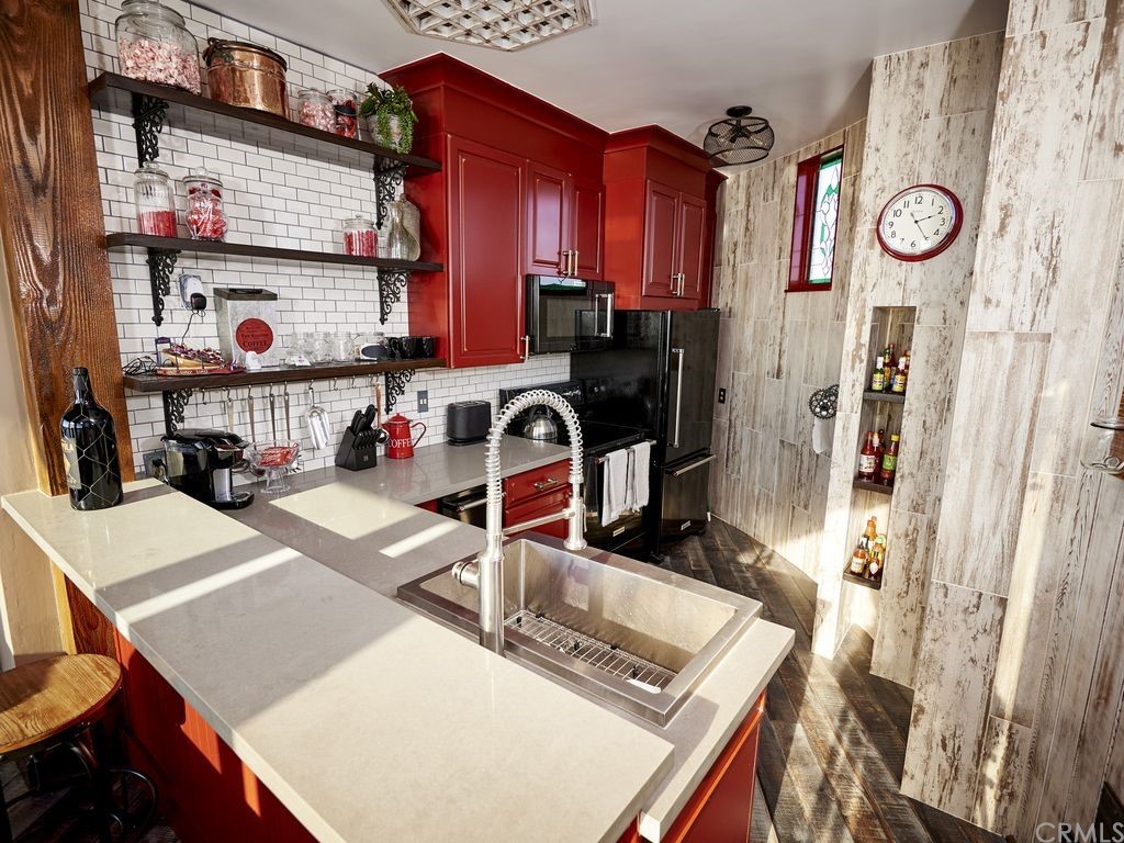 1 Anderson Street Seal Beach, CA 92649 - Photo 12 of 23 a view of a kitchen with fridge and rack