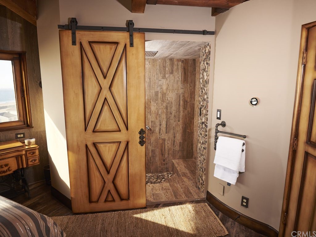 1 Anderson Street Seal Beach, CA 92649 - Photo 16 of 23 wooden floor with table and chair