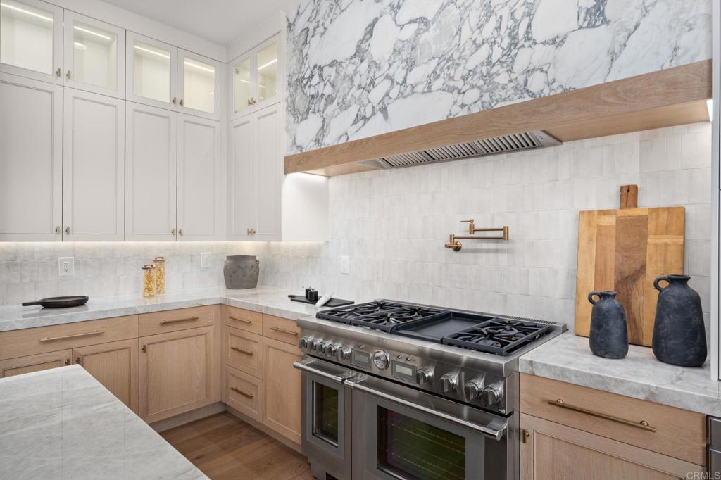 5146 Rancho Verde Trail San Diego, CA 92130 - Photo 11 of 34 a kitchen with a stove and a refrigerator