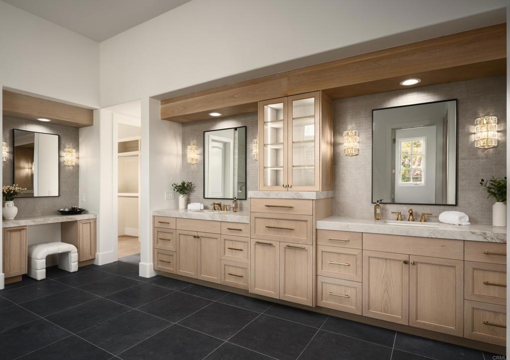 5146 Rancho Verde Trail San Diego, CA 92130 - Photo 16 of 34 a spacious bathroom with a double vanity sink a mirror and a bathtub