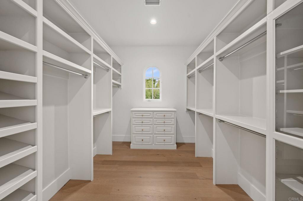 5146 Rancho Verde Trail San Diego, CA 92130 - Photo 17 of 34 a view of walk in closet with empty racks