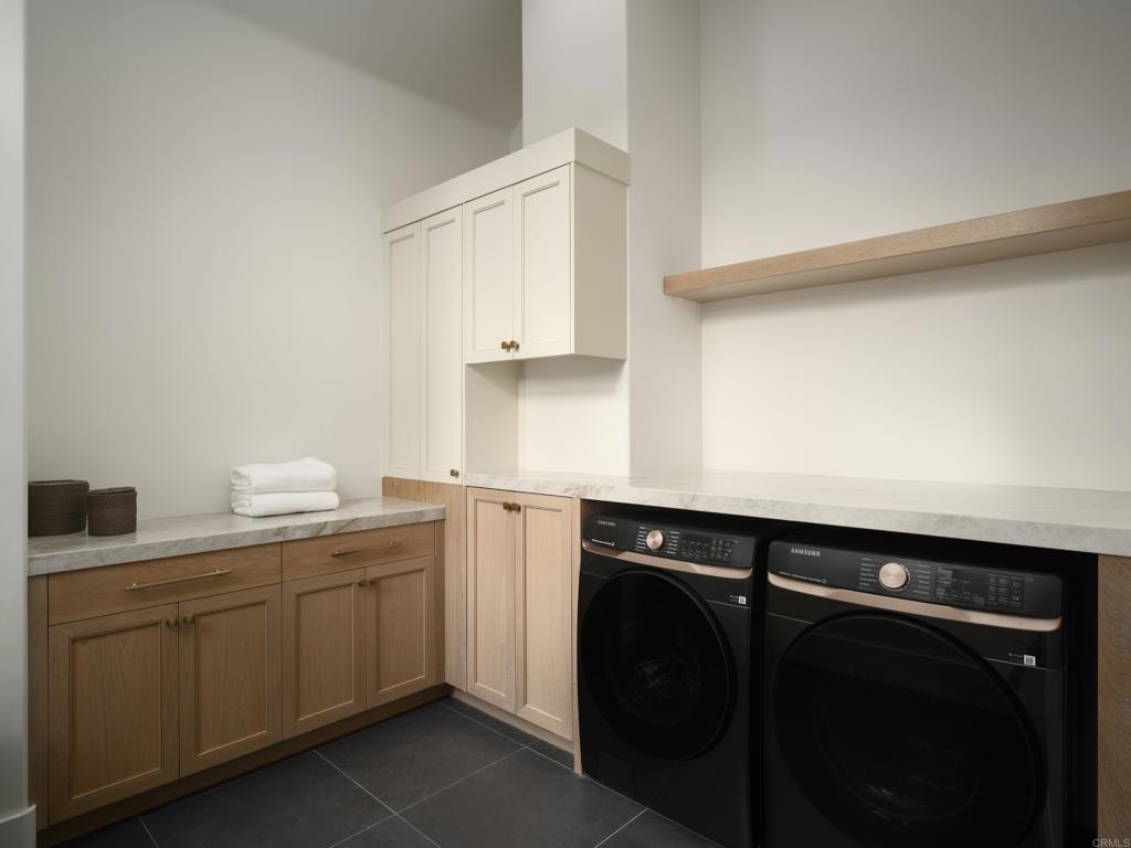5146 Rancho Verde Trail San Diego, CA 92130 - Photo 18 of 34 a utility room with sink dryer and washer