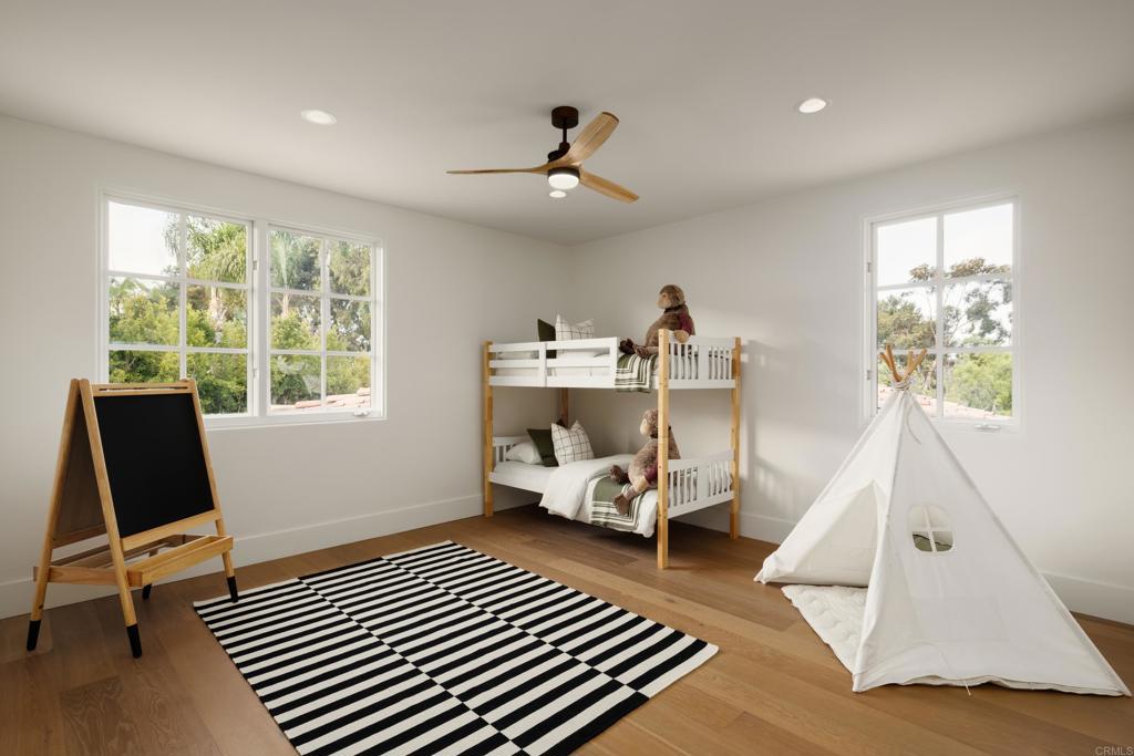 5146 Rancho Verde Trail San Diego, CA 92130 - Photo 24 of 34 a bedroom with furniture and a window