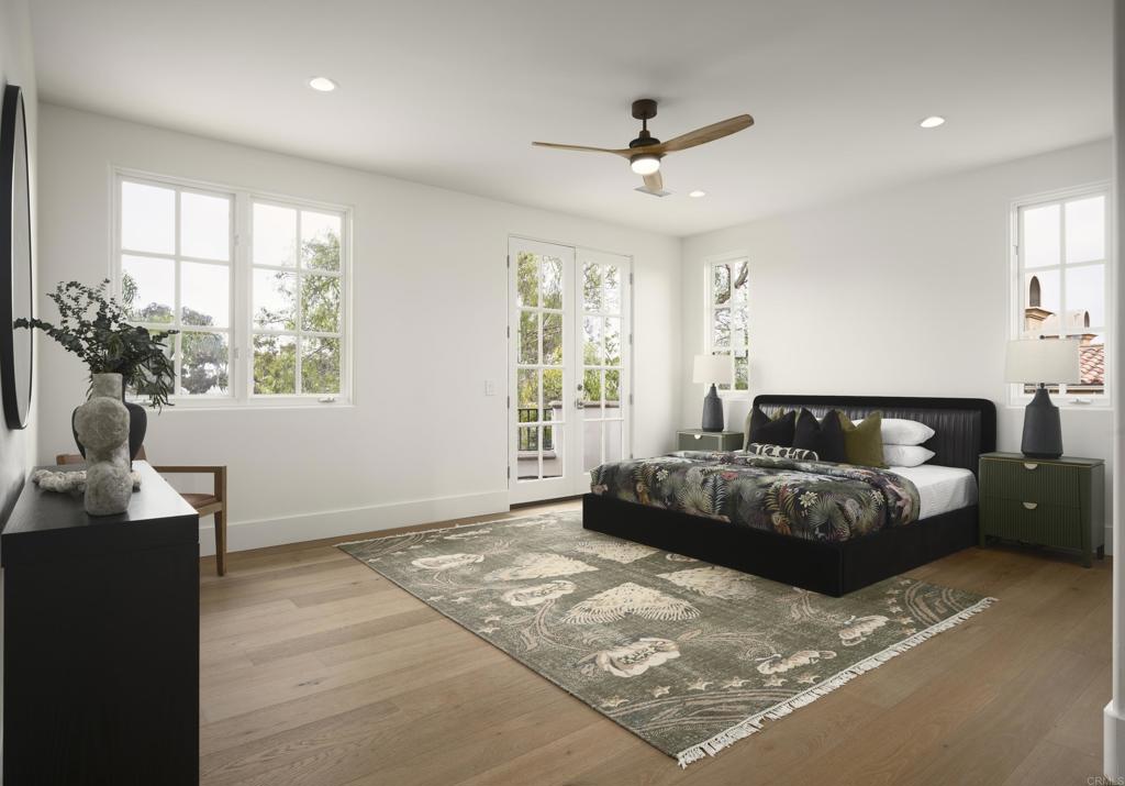 5146 Rancho Verde Trail San Diego, CA 92130 - Photo 27 of 34 a spacious bedroom with a large bed and a window