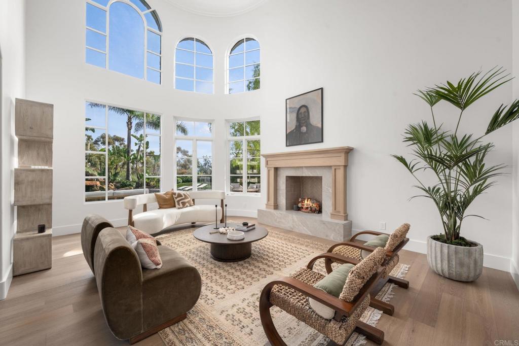 5146 Rancho Verde Trail San Diego, CA 92130 - Photo 7 of 34 a living room with furniture potted plant and a fireplace