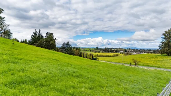 a view of a golf course with a lake