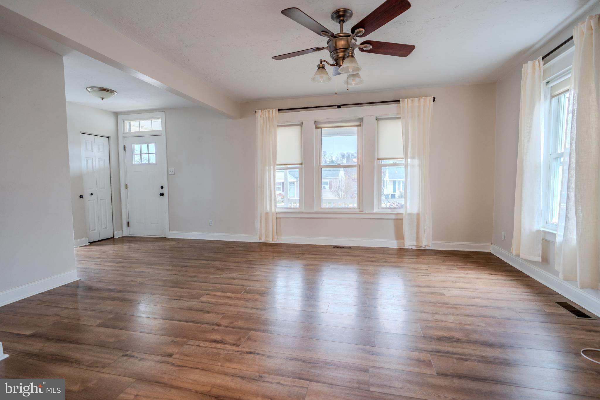 48 West High Street Windsor, PA 17366 - Photo 11 of 23 a view of an empty room with wooden floor and a window
