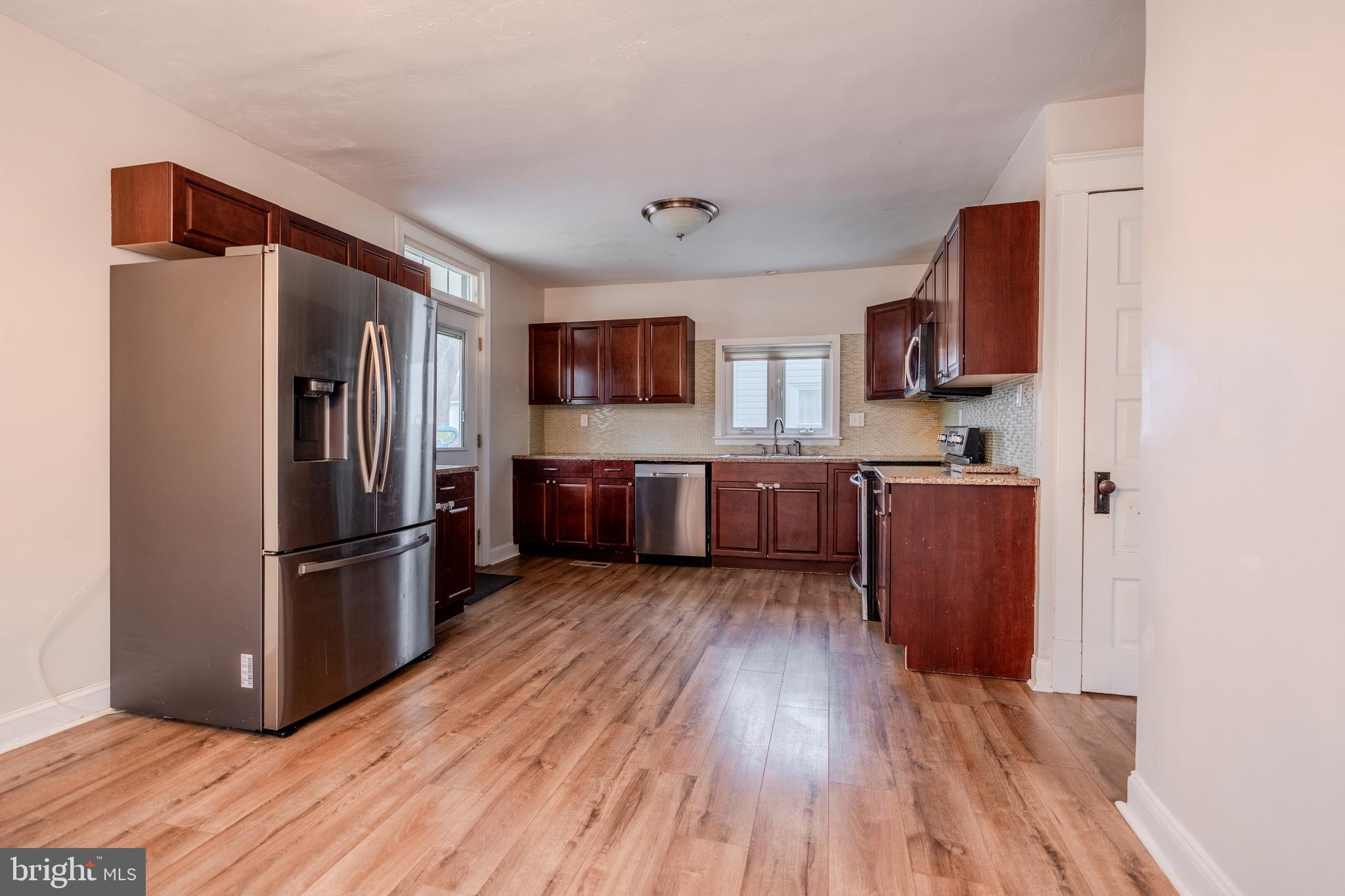 48 West High Street Windsor, PA 17366 - Photo 14 of 23 a kitchen with stainless steel appliances granite countertop a refrigerator microwave and sink