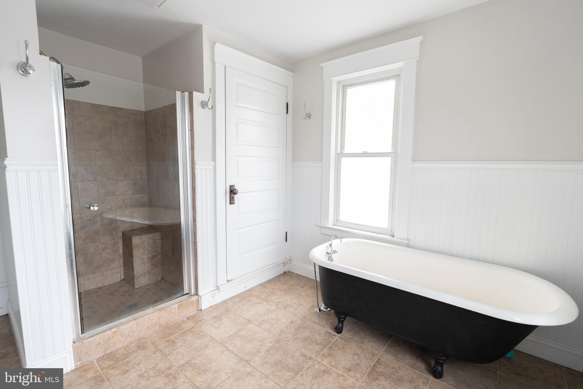 48 West High Street Windsor, PA 17366 - Photo 21 of 23 a bathroom with a bathtub and a shower